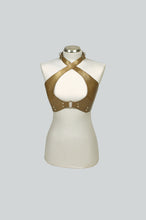 Load image into Gallery viewer, Gold leather halter top on a mannequin against a gray background