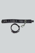 Load image into Gallery viewer, Black vegan  leather hand &amp; wrist cuff on set on a light gray background