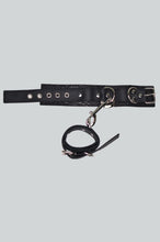 Load image into Gallery viewer, Black leather hand &amp; ankle cuffs on a light gray background