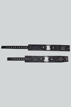 Load image into Gallery viewer, Two black leather straps with metal rings on a light gray background